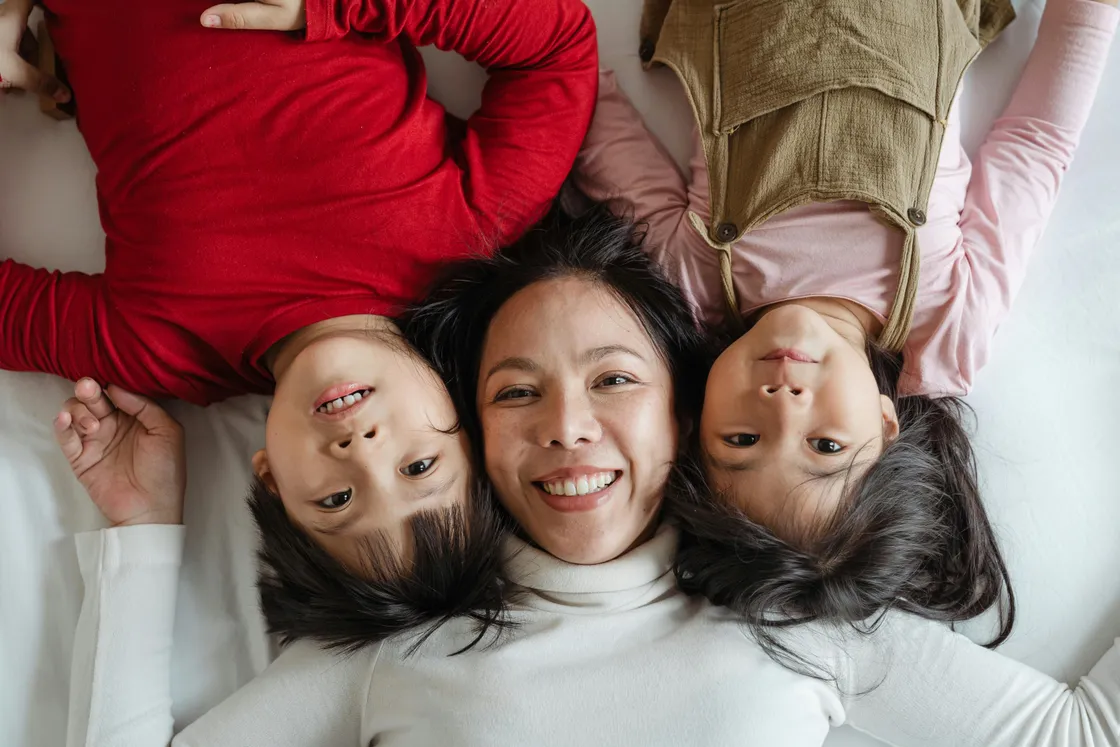 Mother smiling with her two children
