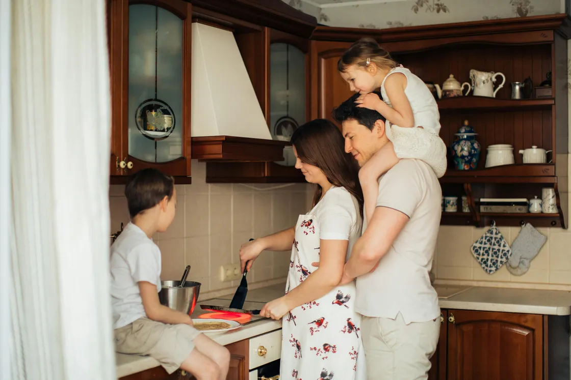 Family cooking together in the kitchen